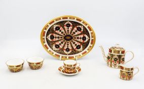 A Royal Crown Derby Miniature Tea set in the 1128 Imari Pattern, comprising of teapot , sugar ,