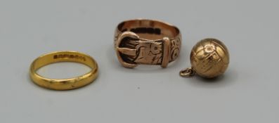 A 22 carat gold band ( approximately 3gm). Together with a 9 carat gold football charm and a 9 carat