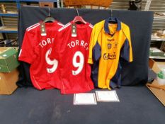 A pair of Liverpool FC shirts, signed by Fernando Torres, together with another 2001 FA Cup