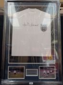 A framed and glazed shirt and montage, Jimmy Greaves, signed with certificate of authenticity.
