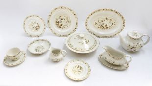 A large Royal Doulton English made Mandalay dinner service to include four tureens, plates, gravy