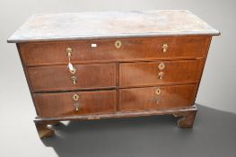 A George I chest of drawers with long single frieze drawer above two side-by-side drawers with brass