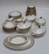 A Royal Doulton Sovereign pattern dinner service. Twelve dinner, salad, side and tea plates.