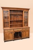George III oak and pine dresser with three plate racks flanked by two glazed cupboards, two