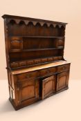 Mid 20th century solid oak reproduction Georgian-style oak dresser with three-tier plate rack and
