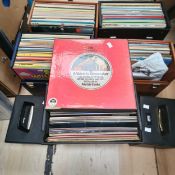 A collection including 2 small cases of 7 inch records mostly pop from the 1970s plus lp cases