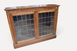 Early 20th century bookcase with glazed front, two internal shelves, leaded glass and burr oak