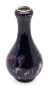 A Chinese Jun glazed bottle shaped vase, probably late Qing dynasty, approx. 15cm high. Further
