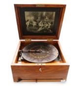 A compact tabletop late 19th C Polyphon Music box, with a classical scene inlaid to the lid,