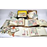 Collection of World Stamps, spanning various countries, some loose and some in albums. (qty)