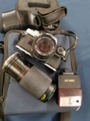 Olympus OM10 35mm camera together with f=200mm zoom lens, Canon speedlite 244T Flash and Olympus
