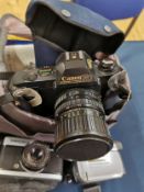 Canon T50 35mm camera with 35-70mm lens, together with bag including Olympus Trip 35, Sony