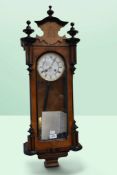 Late 19th century German-made walnut and ebonised 8-day wall clock with round enamel face, Roman