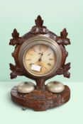 Early 20th century German-made mantel alarm clock in ornate Black Forest-style wooden case, Roman
