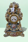 A 19th century Parisian porcelain mantel clock on a matching stand in turquoise and gilt with a
