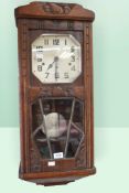 1920s/30s oak cased 8-day wall clock with Arabic numerals