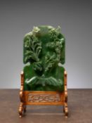 (R) A GREEN JADE SCREEN WITH BAT, FLOWERS, AND BIRDS, CHINA, QING DYNASTY (1644-1911)