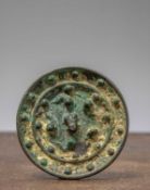 (R)A CHINESE BRONZE MIRROR WITH KNOB , HAN DYNASTY (206 BCE - 220 CE)