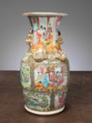 (R) A BULBOUS FAMILLE ROSE VASE WITH GILT RELIEF HANDLES, CHINA , QING DYNASTY 19TH CENTURY