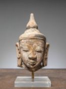 (R) A HEAD OF A BUDDHA, RED SANDSTONE, BIRMA MANDALAY 1850