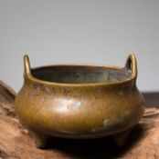 A BRONZE TRIPOD CENSER WITH LOOP HANDLES CHINA, CAST WITH A XUANDE MARK