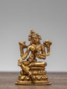 A GILT-BRONZE FIGURE OF GREEN TARA, TIBET, 18TH CENTURY