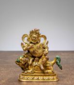 A GILT BRONZE JAMBHALA, CHINA QING DYNASTY (1644–1911)