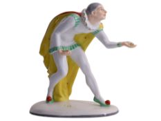 A PORCELAIN FIGURE OF A JESTER WITH CONFETTI, PIRKEN HAMMER, CZECHOSLOVAKIA, CIRCA 1930