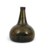 A green glass wine bottle, c.1720-40, of onion shape, the squat body rising to a tapering neck with 