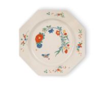An octagonal salt-glazed stoneware plate, c.1755-60, unusually decorated in the Kakiemon palette wit