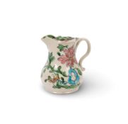A Staffordshire salt-glazed stoneware milk jug, c.1750-60, of silver shape, brightly enamelled with 