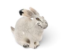 Jennie Hale (British, b.1956), a large raku-fired pottery sculpture of a hare, seated with ears back