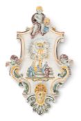 A good Samson faïence wall plaque in imitation of Moustiers, late 19th century, flanked by winged pu