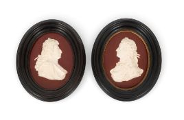 A rare pair of Wedgwood portrait plaques, c.1775-85, one with a raised profile portrait of George II