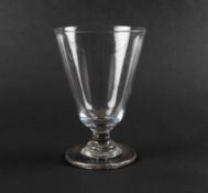 A large toasting glass or goblet, c.1760, the deep round funnel bowl raised on a short plain stem an