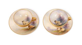 A pair of Royal Worcester teacups and saucers by Ernest Barker, date codes for 1922, each piece pain