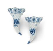 A pair of Liverpool delftware wall pockets, c.1760, each formed as a spiral-moulded cornucopia paint