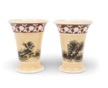 A pair of Spode mocha ware spill vases, early 19th century, the flared forms decorated with black se