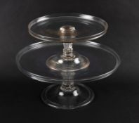 A graduated pair of glass tazzae, c.1750, with wide galleried tops raised on moulded pedestal stems 