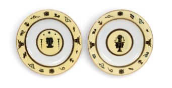 A rare pair of Derby plates from an Egyptian service, c.1815, painted in dark blue and gilt with sty
