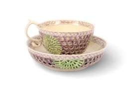 A rare Yorkshire creamware double-walled cup and saucer, c.1775-80, the external wall pierced with r