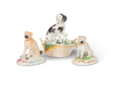 Two Derby figures of pug dogs, c.1780-90, each seated with its head slightly turned to the left, rai