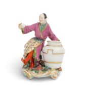 A Chelsea chinoiserie flower holder figure, c.1762, modelled as a Chinaman wearing Eastern dress and