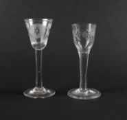Two wine glasses of Jacobite significance, mid 18th century, one with a round funnel bowl engraved w