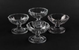 A set of four cut glass salts, 19th century, with navette shaped bowls raised on thick oval bases, 8