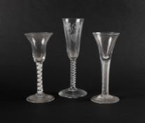 Three English drinking glasses, c.1760-70, a wine glass with drawn trumpet bowl over a dense airtwis