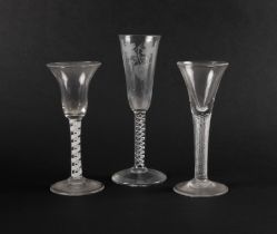 Three English drinking glasses, c.1760-70, a wine glass with drawn trumpet bowl over a dense airtwis