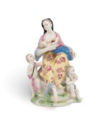 A rare Bow figure of Charity, c.1758-62, modelled as a woman seated and nursing a baby at her breast