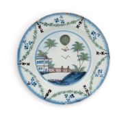 A Lambeth delftware commemorative 'ballooning' plate, c.1785, painted in blue, green and manganese w