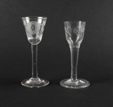 Two wine glasses of Jacobite significance, mid 18th century, one with a round funnel bowl engraved w